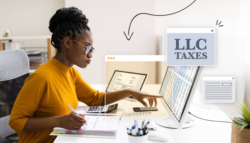 Business women seated at her desk filing her LLC taxes on her computer